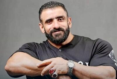  حرکت عجیب هادی چوپان پشت به دوربین؛ گرگ پارسی پنج مرتبه با وزنه فوق سنگین نشست و برخاست کرد